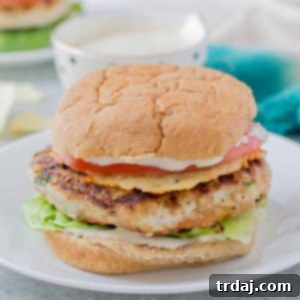 Close up image of a prepared Chicken Caesar Burger.