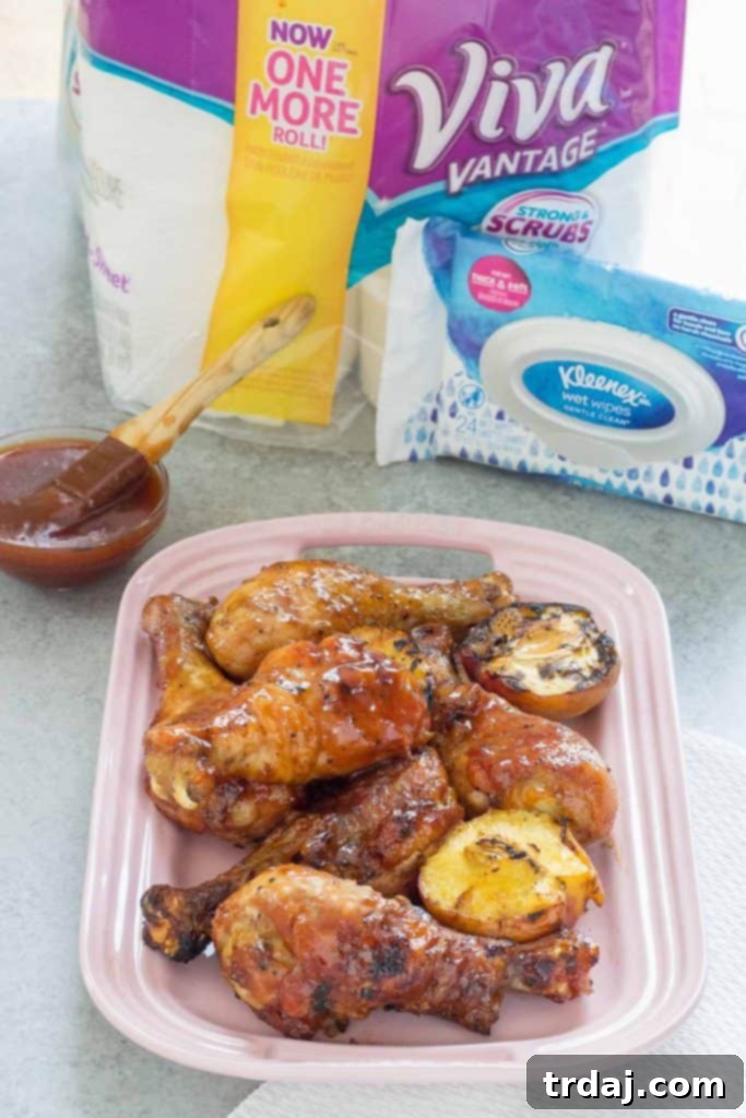 BBQ Peach Ginger Glazed Chicken Legs on a platter, ready to be served, showcasing their sticky glaze and golden-brown skin.