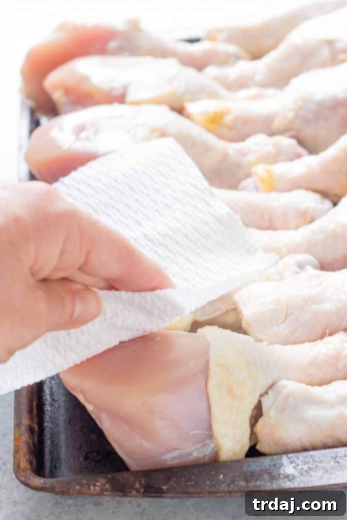 A vibrant platter of BBQ Peach Ginger Glazed Chicken Legs, garnished with fresh herbs, ready to be enjoyed.