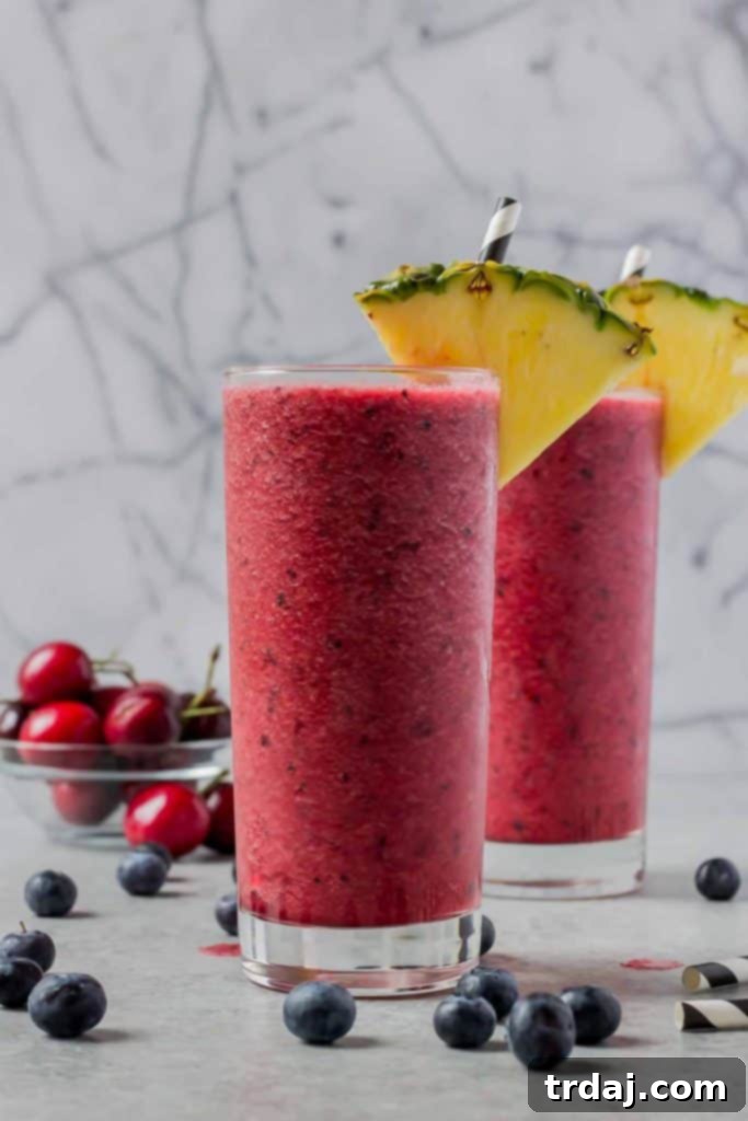 Refreshing Berry Pineapple Smoothie in a Tall Glass