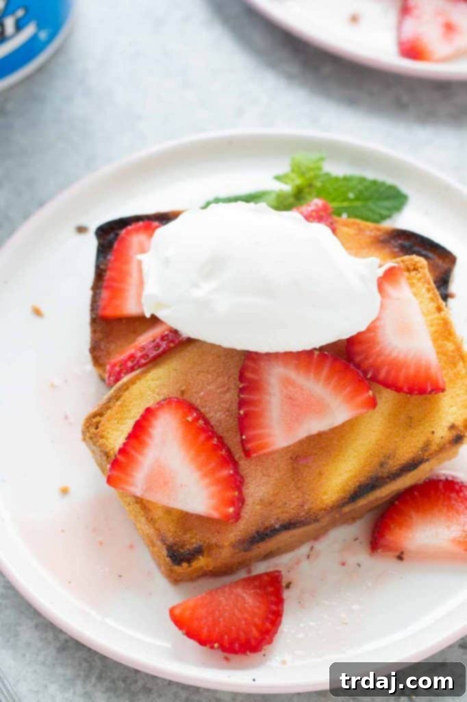Grilled Strawberry Shortcake slices with strawberries and whipped cream