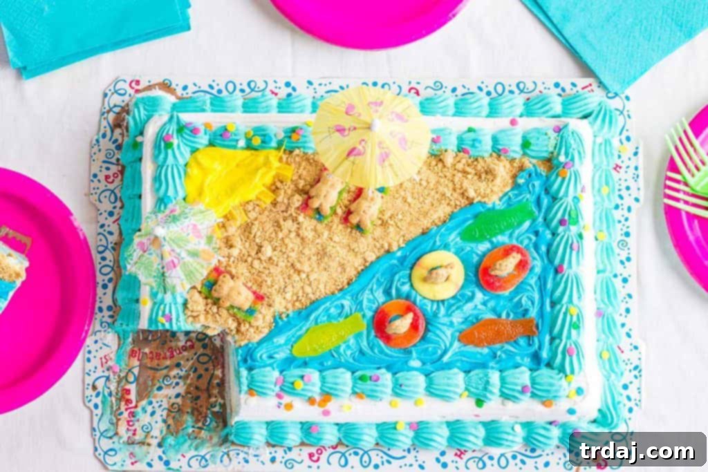 Overhead view of a beautifully decorated Easy Summer Beach Cake featuring blue frosting waves, graham cracker sand, and candy beachgoers.