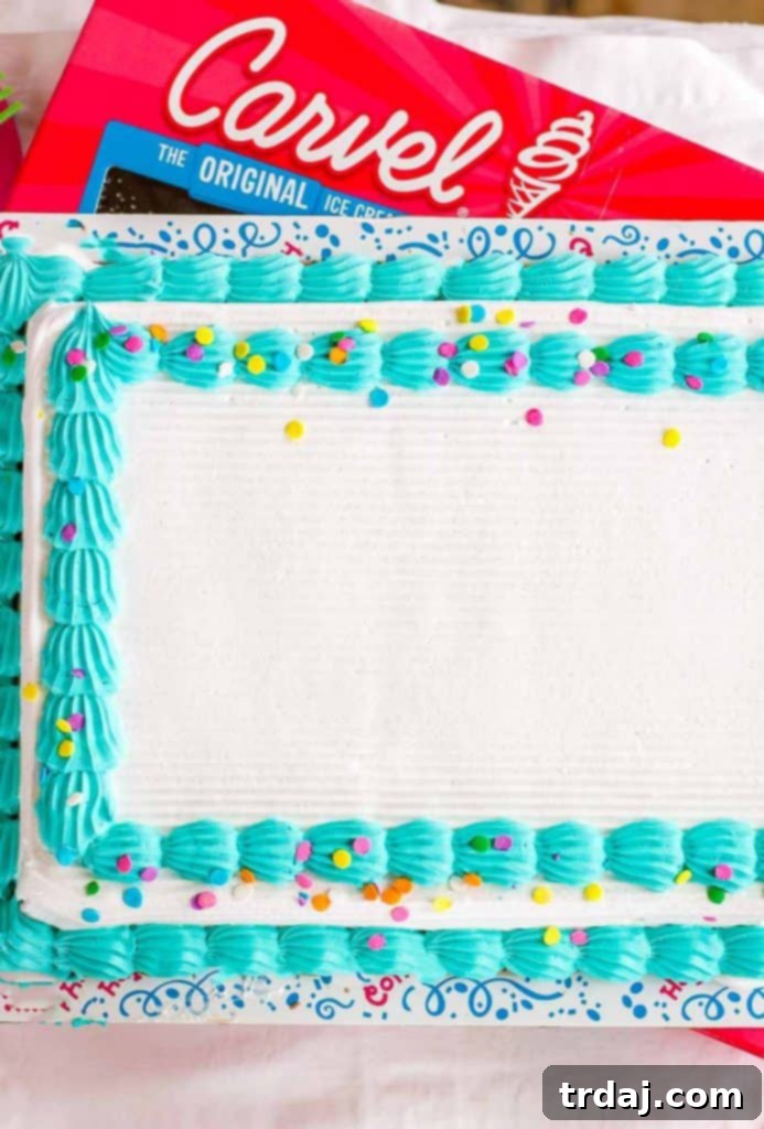Easy Summer Beach Cake on a picnic blanket with fresh fruit, ready for a fun outdoor gathering.