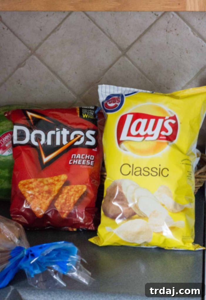Assortment of chips and soda, including Doritos, Lay's, and Pepsi, purchased at Jewel-Osco