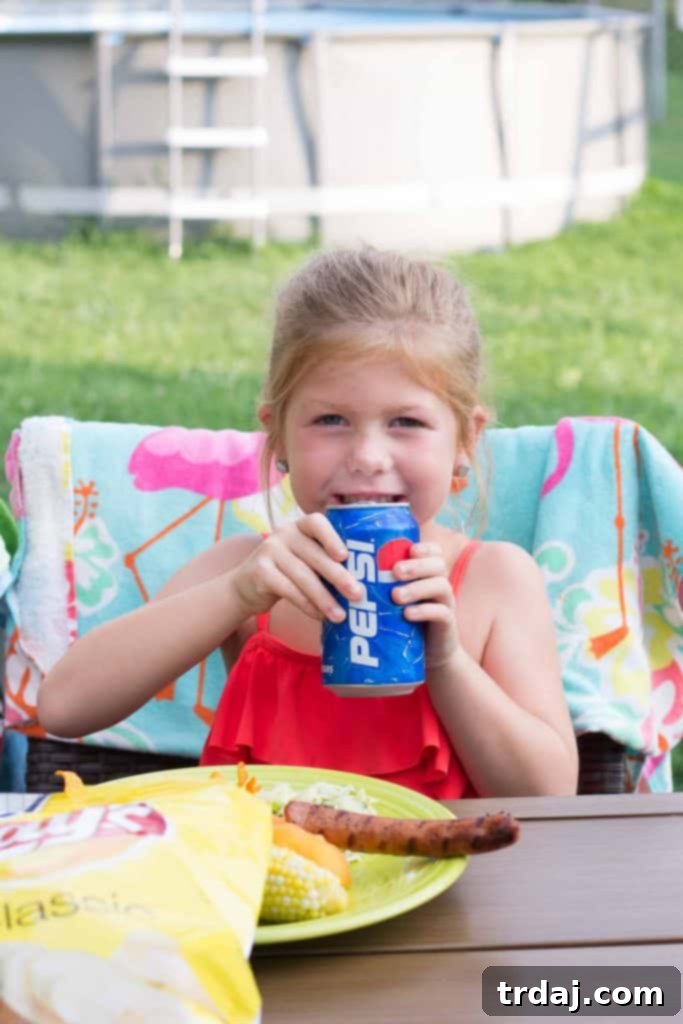 Friends enjoying drinks and snacks outdoors, celebrating summer