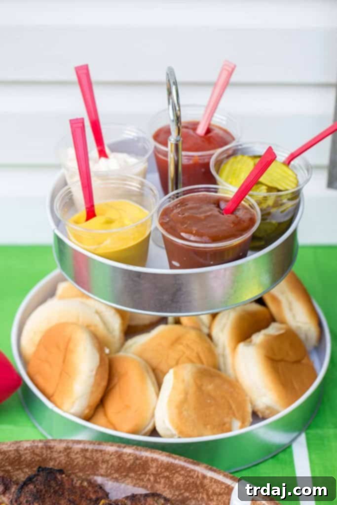 A vibrant burger bar setup with a variety of toppings and sauces for game day guests.