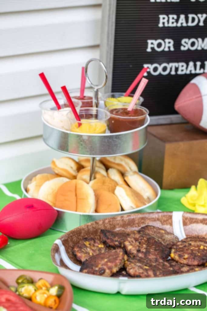 A selection of classic game day munchies like chips and pretzels on a festive table.