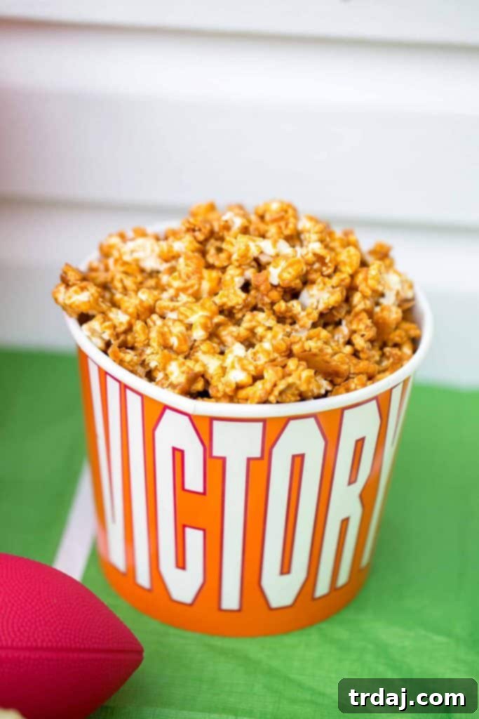 A bowl of the irresistible Spicy Dr Pepper Caramel Popcorn, the ultimate game day snack.
