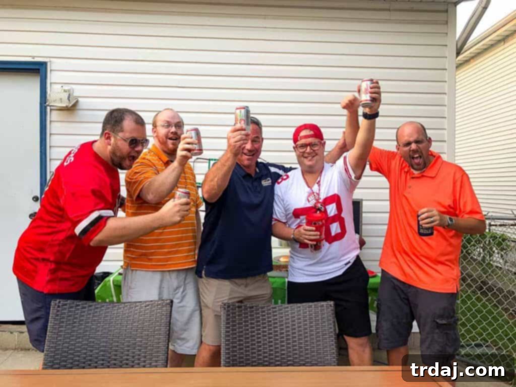 A festive homegate spread with Dr Pepper, grilled food, and cheerful decorations for game day.