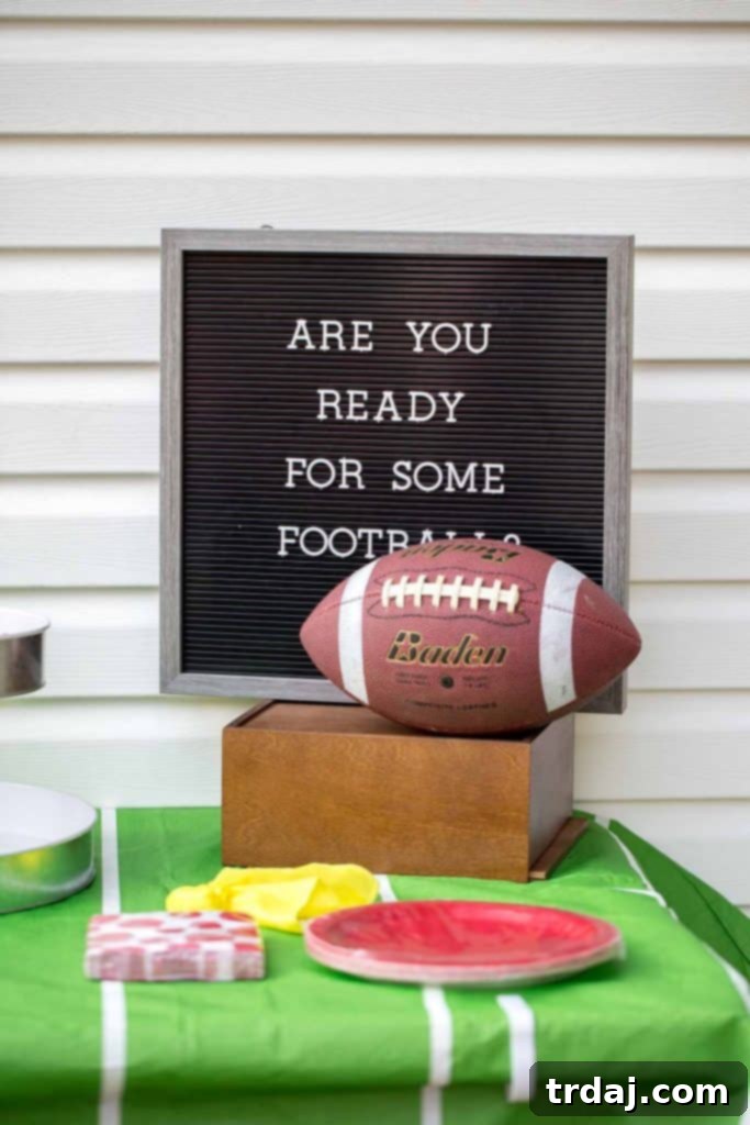 A festive game day tablescape featuring a letterboard with a football-themed message.