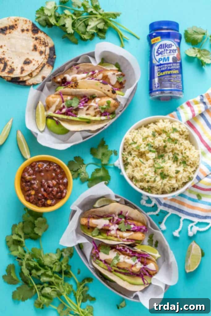 Delicious Spicy Baja Fish Tacos with fresh toppings and lime