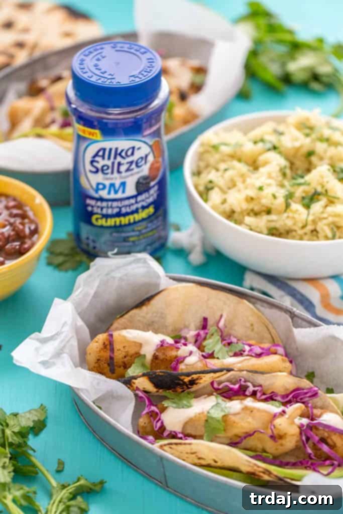 Homemade Spicy Baja Fish Tacos on a platter with fresh lime