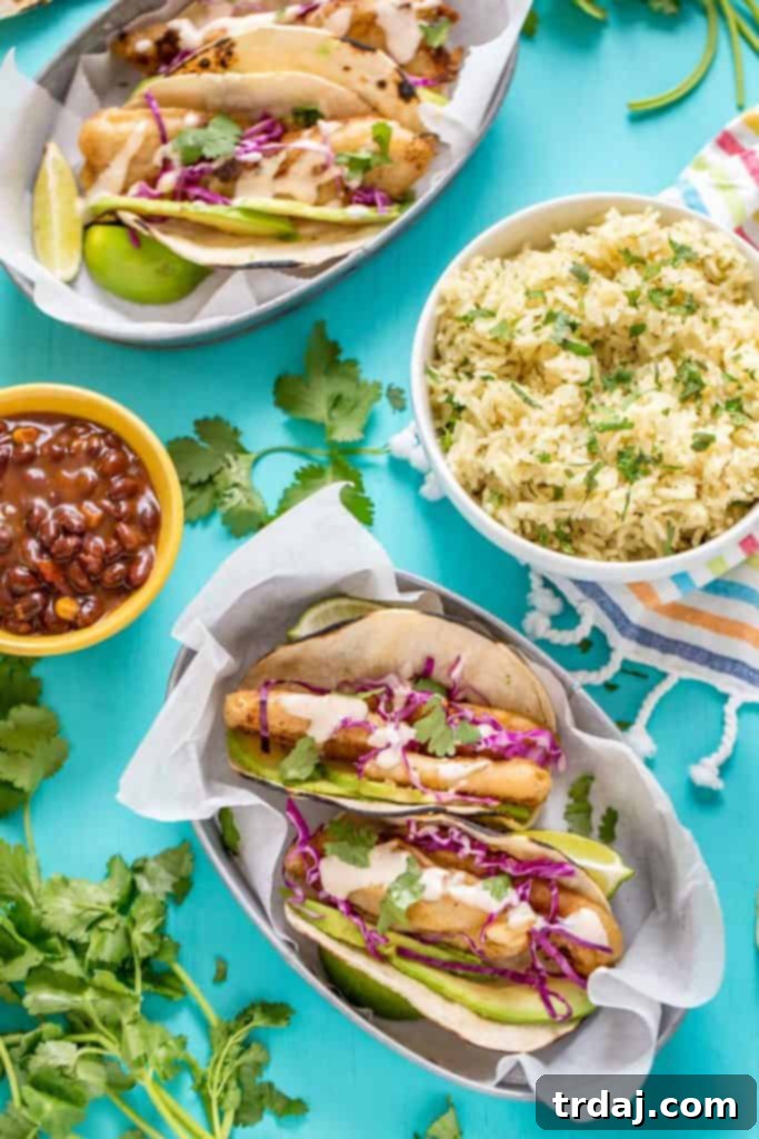 Platter of several Spicy Baja Fish Tacos with lime and cilantro