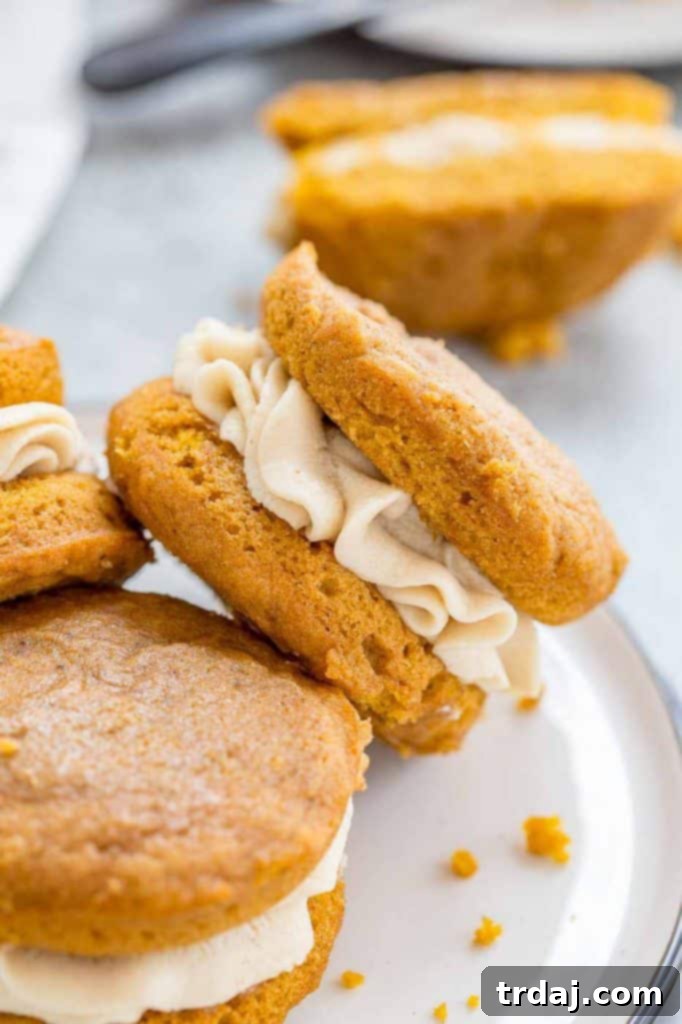 Stacked Pumpkin Spice Latte Whoopie Pies showcasing the creamy filling