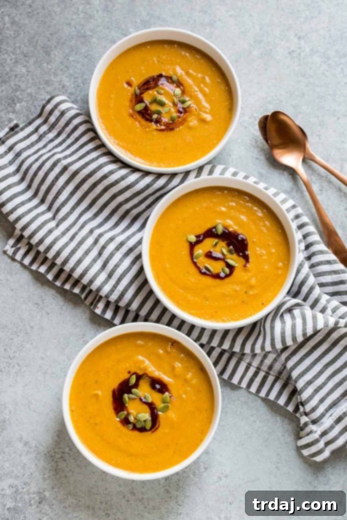Pumpkin Cheddar Ale Soup with garnishes