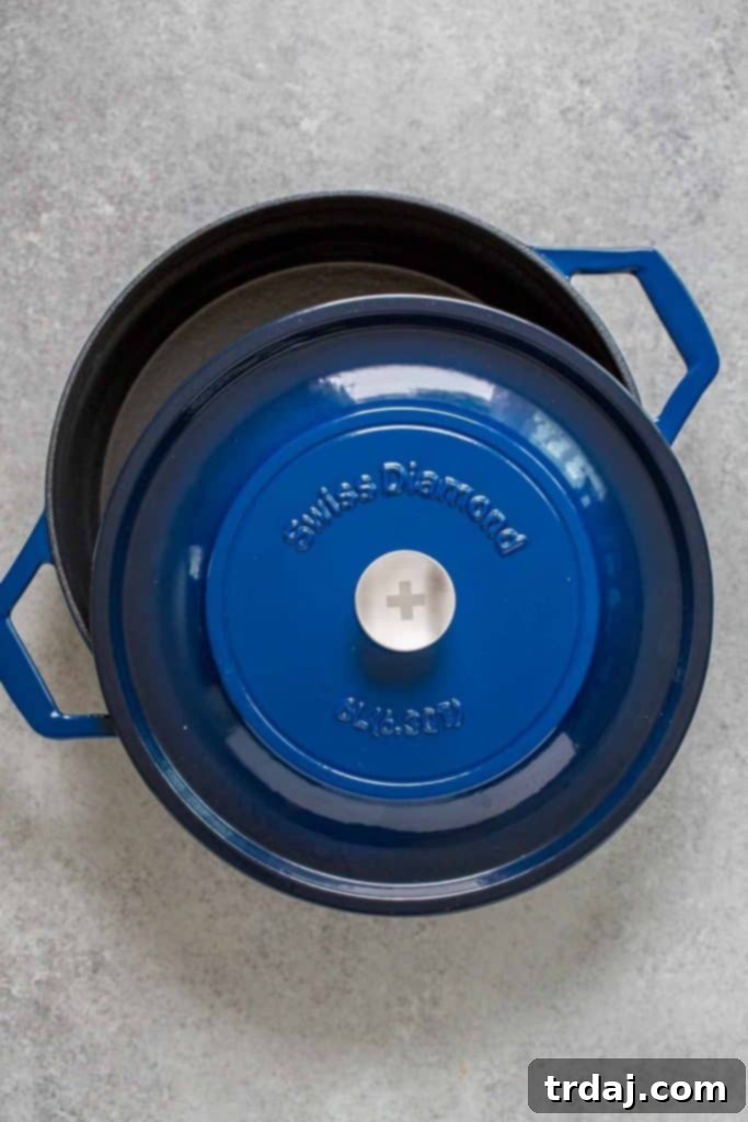 For our second recipe for Apple Week I am bringing you something savory to cook for these Fall nights. This one is a classic with bone in pork chops, because they have more flavor, sweet Envy apples, the same ones I used in these Apple Cinnamon scones, some onions and cinnamon from The Spice House. But First can we talk about the most gorgeous pan I now own?! This Swiss Diamond 6.3 Qt shallow pan. Not only is it stunning but it retains it’s heat so well I vow to never take it off my stove One Pan Pork Chops with Apples and Cinnamon