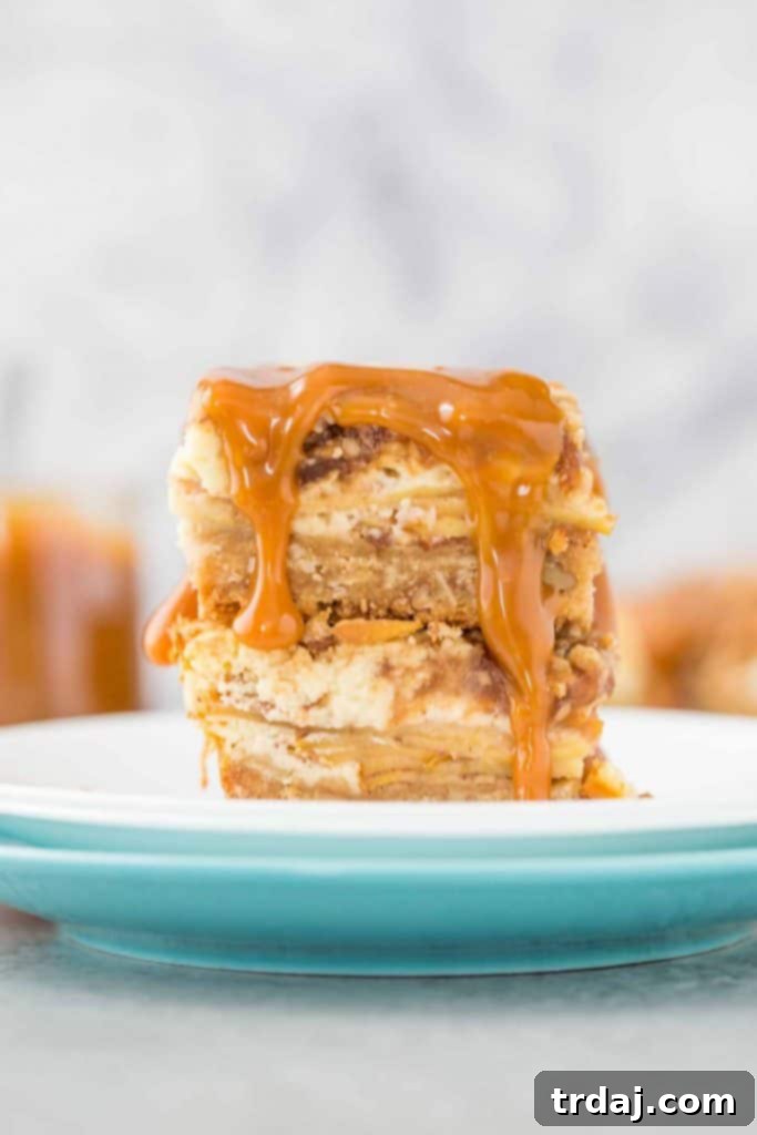 Delicious Caramel Apple Cheesecake Bars with a flaky crust, creamy cheesecake, and rich caramel swirl.