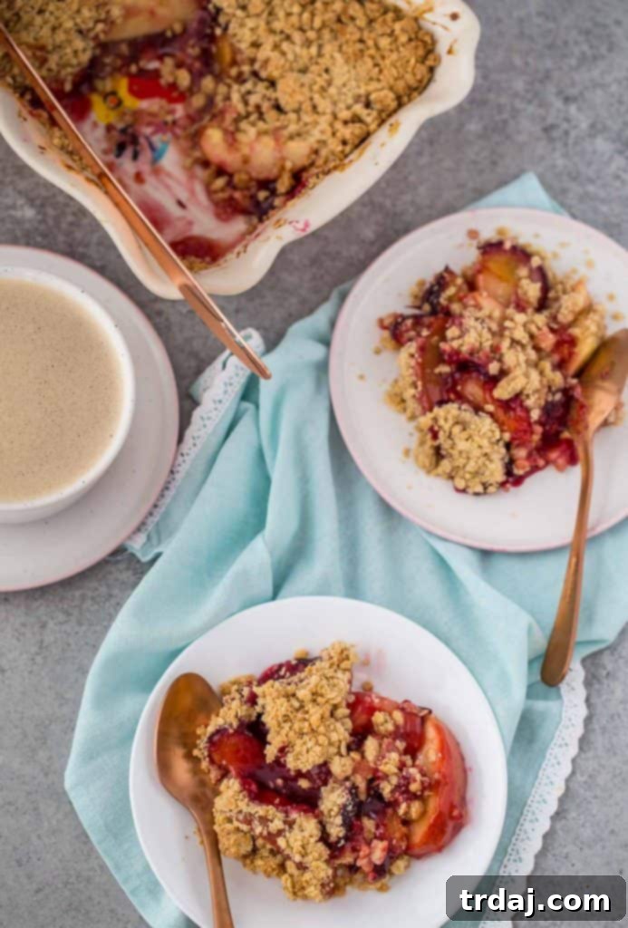 Apple and Plum Crumble served warm in a baking dish.