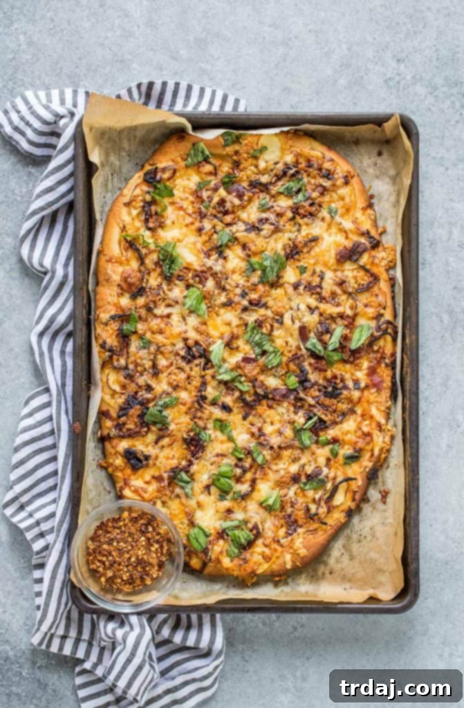 Apple, Bacon and Caramelized Onion Pizza, a perfect fall savory pie with crisp apples, salty bacon, sweet caramelized onions, and cheesy fontina and sharp white cheddar.
