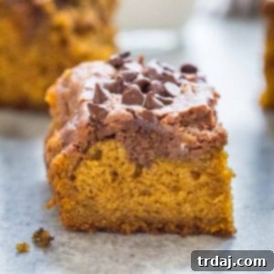 Finished Chocolate Swirled Pumpkin Bars on a cutting board.