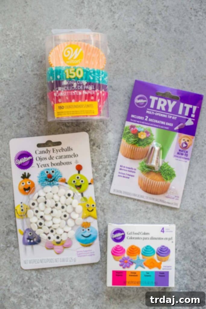 Assortment of colorful Wilton cupcake liners and decorating tools for Halloween monster cupcakes