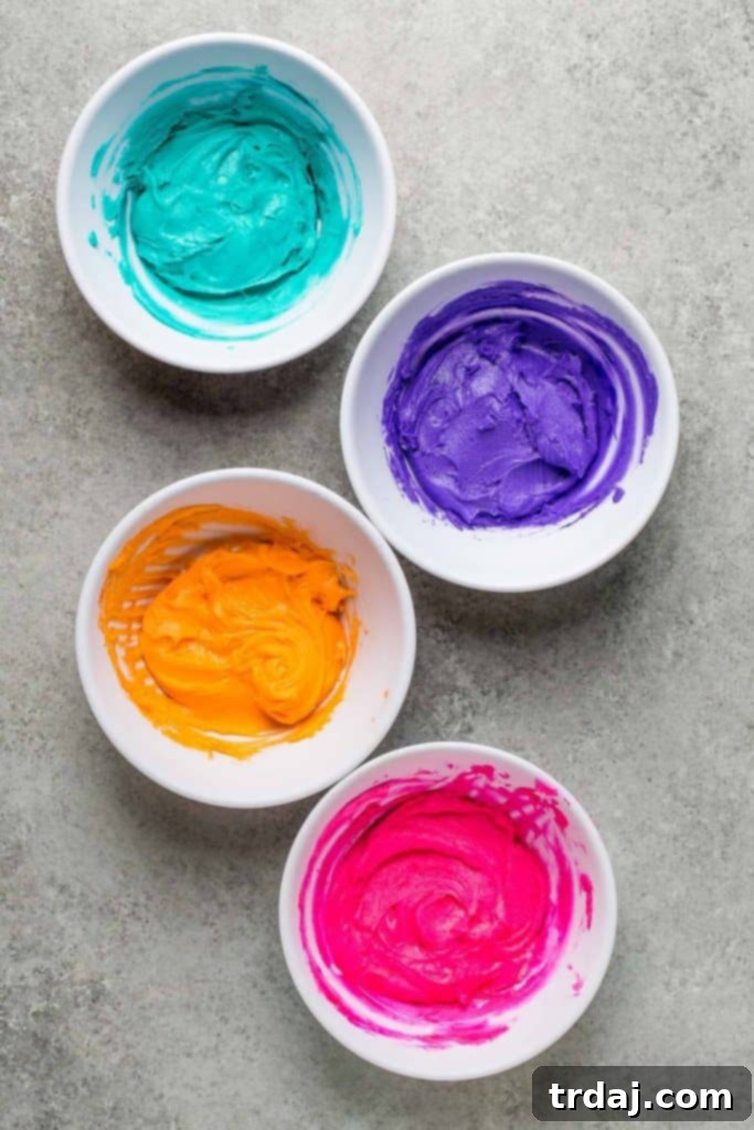 Close-up of vibrant sprinkles and colorful gel food coloring, essential for Monster Piñata Cupcakes