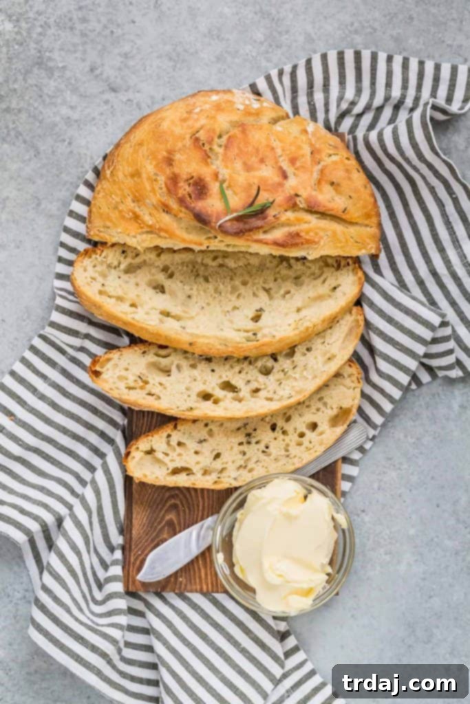 Aromatic No-Knead Rosemary Olive Oil Loaf 3 Freshly baked No-Knead Rosemary Olive Oil Bread next to prepared Michael Angelo's meal