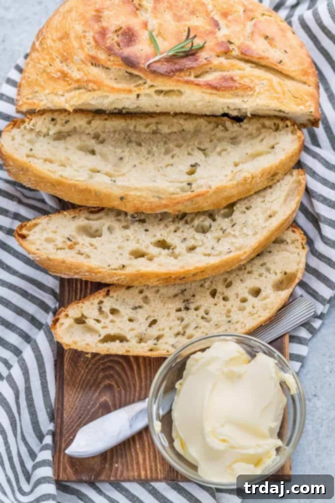 Aromatic No-Knead Rosemary Olive Oil Loaf 6 No-Knead Rosemary Olive Oil Bread cooling on a rack