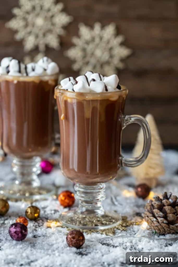 Overhead view of a Salted Caramel Hot Chocolate Toddy with lush toppings and a festive background, perfect for a holiday feature