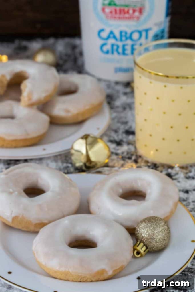 Freshly Baked Eggnog Cinnamon Roll Donuts on a Cooling Rack
