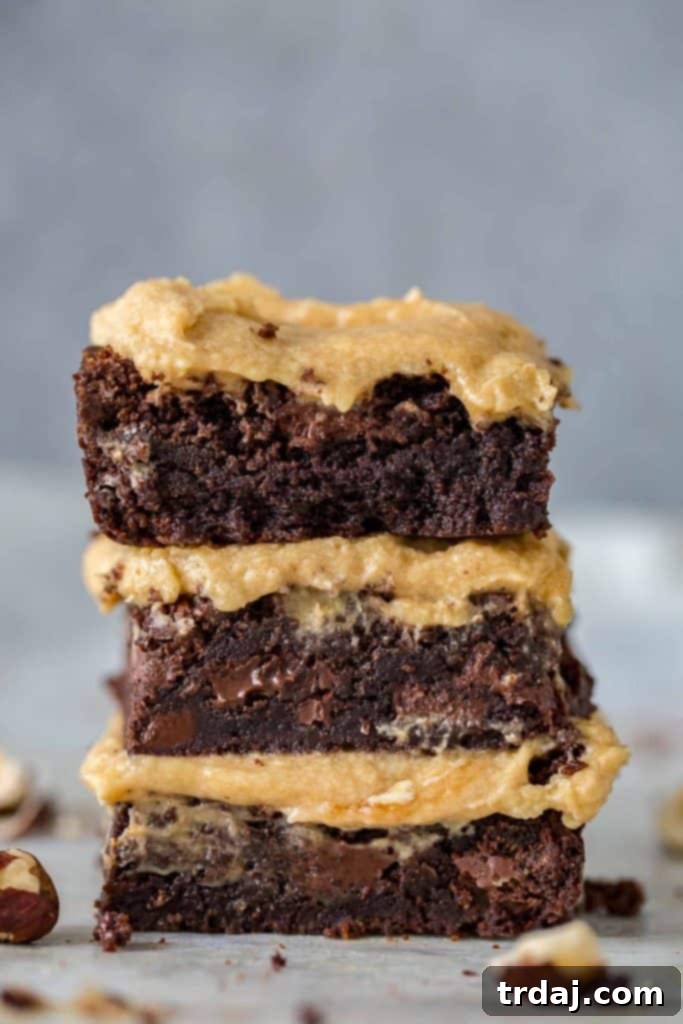 These Hazelnut Espresso Brownies are chewy, fudgy and packed with rich coffee flavor to bring out an intense chocolate experience only highlighted by the hazelnut buttercream frosting! Hazelnut Espresso Brownies - chewy, fudgy, rich coffee chocolate dessert