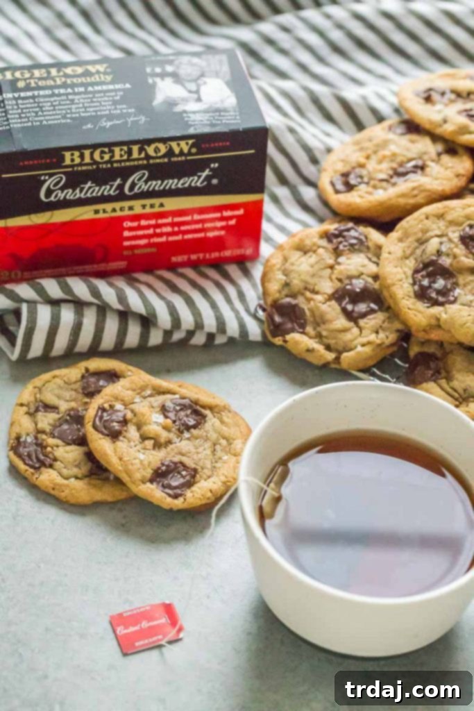 A warm mug of Bigelow Tea next to freshly baked Tahini Toffee Chocolate Chip Cookies