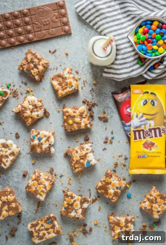 M&M'S® Monster S'mores Bars are a cookie lover's dream with a peanut butter crumble crust, melty M&M'S® Chocolate Bars and marshmallows toasted to perfection! Homemade M&M'S® monster s'mores bars