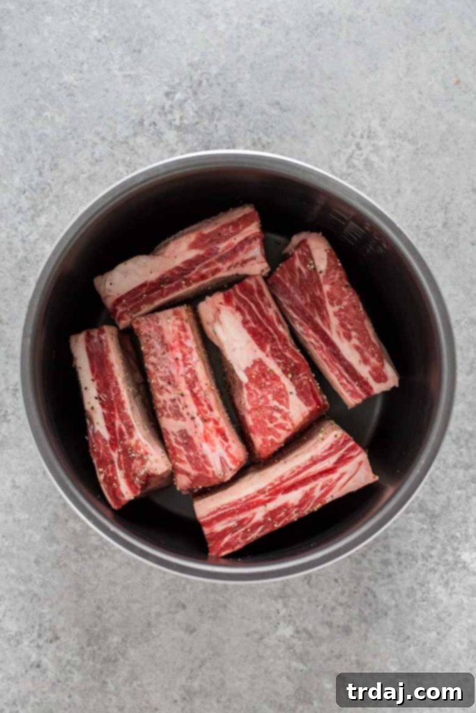 Searing beef short ribs in the Instant Pot for deep flavor