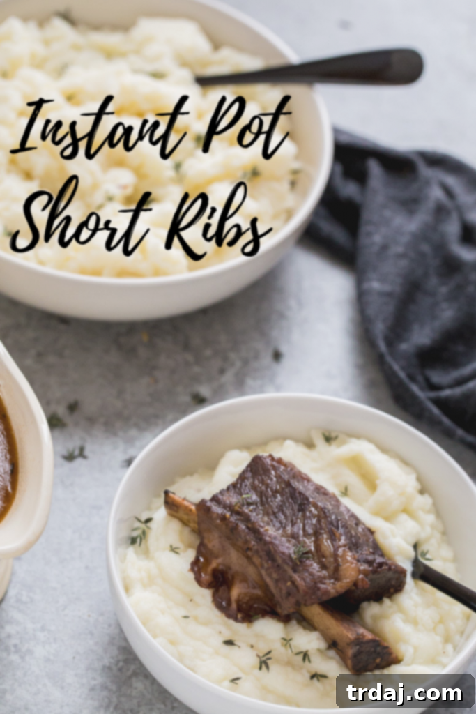 Instant Pot Short Ribs plated with a side of mashed potatoes and a vibrant green garnish