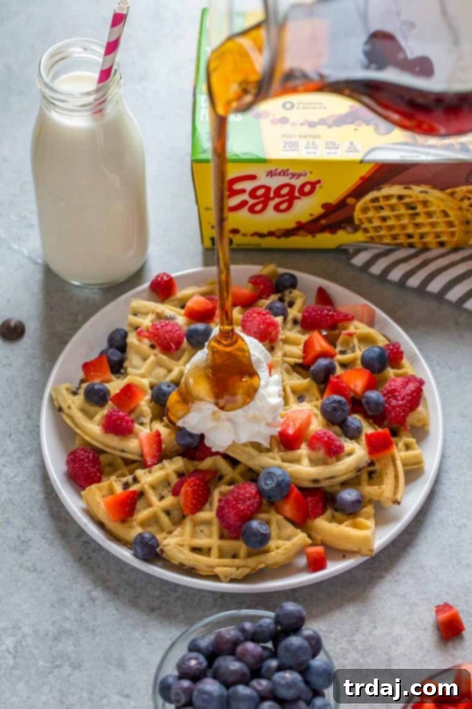 Close-up of Fruity Breakfast Waffle Nachos with vibrant fruit and whipped cream