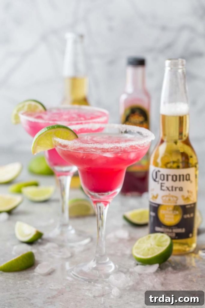 Close-up of a DIY Beergarita bar featuring fresh fruits and Corona Extra