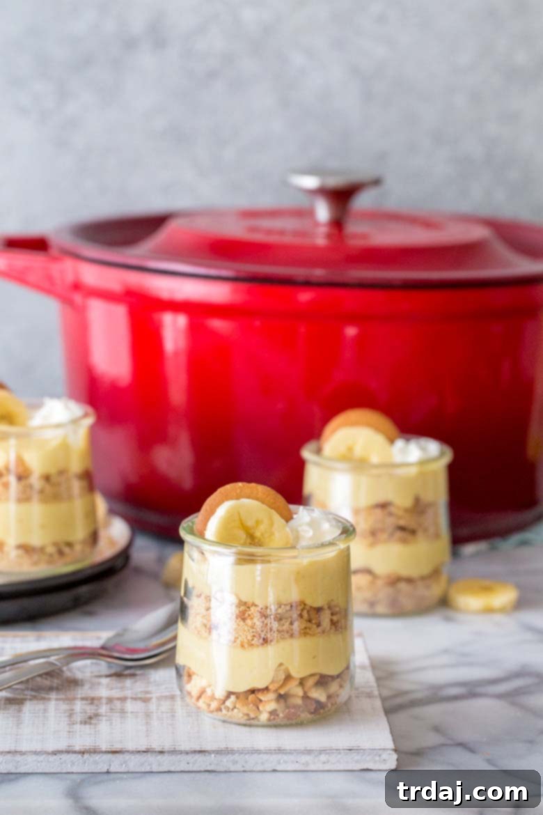 Close-up of the vibrant red Swiss Diamond casserole dish contrasting with pale yellow banana pudding.