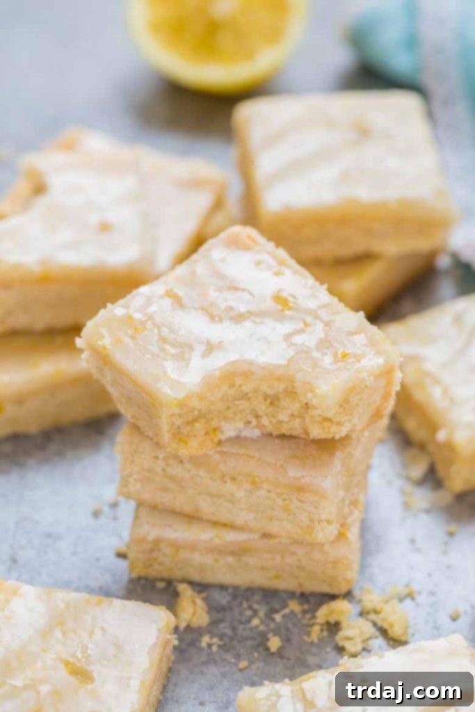 These Lemon Shortbread Bars are buttery and bursting with bright and fresh lemon flavors! Stacked Lemon Shortbread Bars