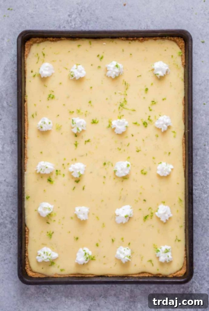 Delicious Sheet Pan Key Lime Pie ready to be enjoyed.