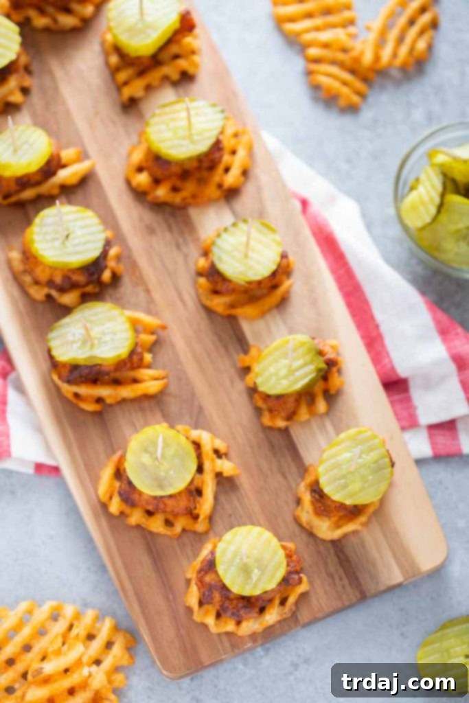 Nashville Hot Chicken Waffle Poppers 2 Delicious Nashville Hot Chicken Waffle Bites ready to serve at a party.