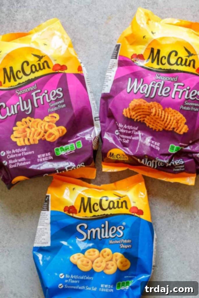 Nashville Hot Chicken Waffle Poppers 3 A close-up shot of crispy Nashville Hot Chicken Waffle Bites with pickles on top.