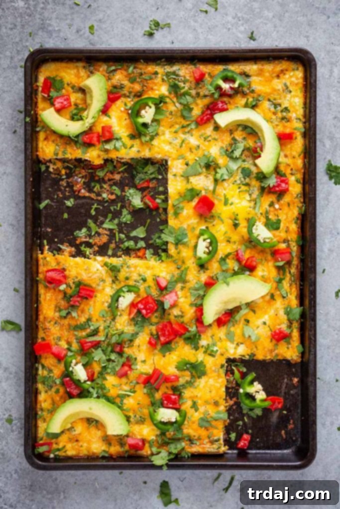 This Sheet Pan Mexican Frittata is packed full of delicious Mexican flavors and is perfect for a crowd or meal prep! Delicious Sheet Pan Mexican Frittata with vibrant toppings, ready to serve for breakfast or brunch