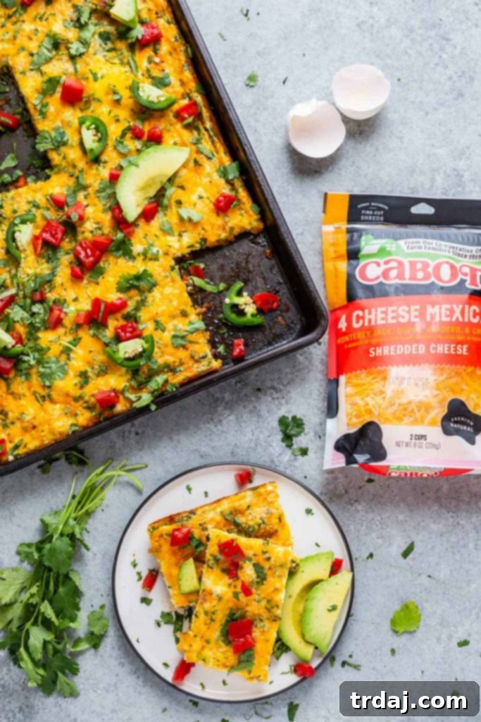This Sheet Pan Mexican Frittata is packed full of delicious Mexican flavors and is perfect for a crowd or meal prep! Beautifully presented Sheet Pan Mexican Frittata with a variety of fresh toppings, ready to serve