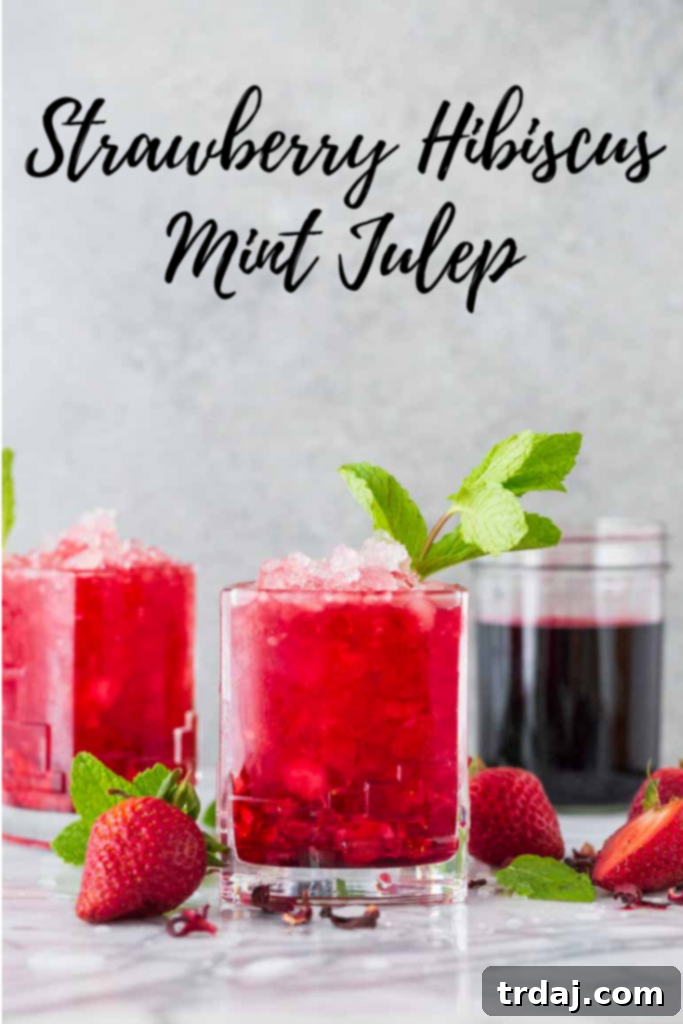 BrunchWeek Strawberry Hibiscus Mint Julep A collection of vibrant Strawberry Hibiscus Mint Juleps with other brunch items, set for a festive and colorful display.