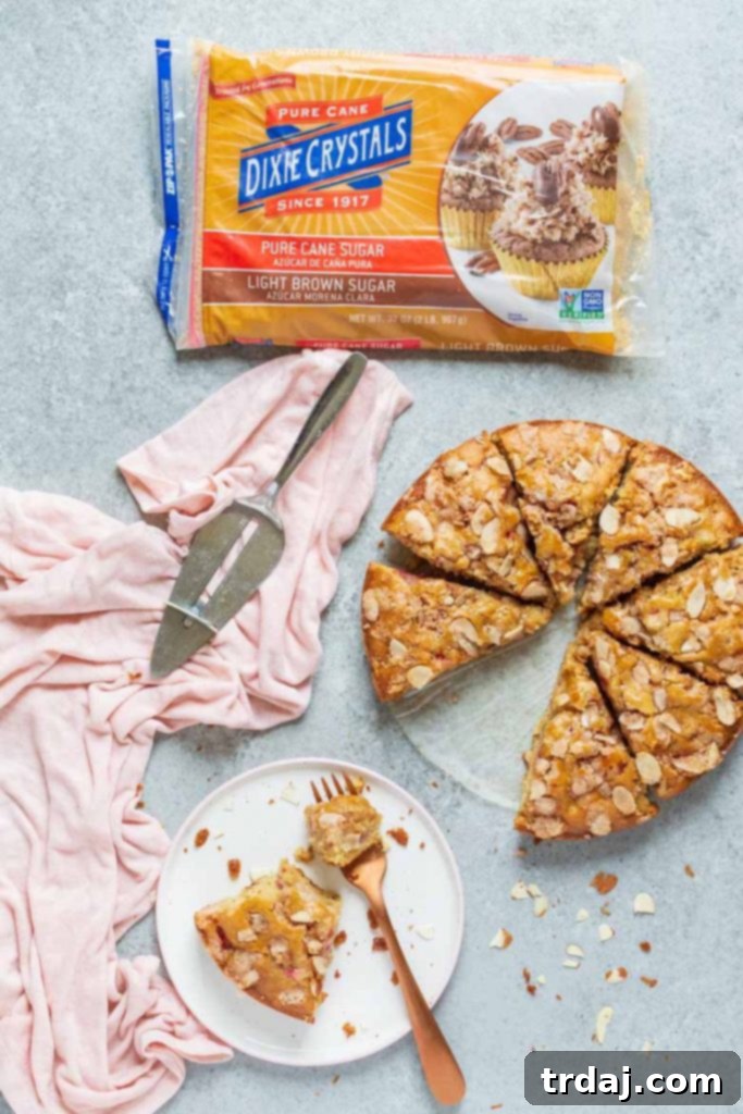 Slice of Strawberry Rhubarb Coffee Cake with almond topping