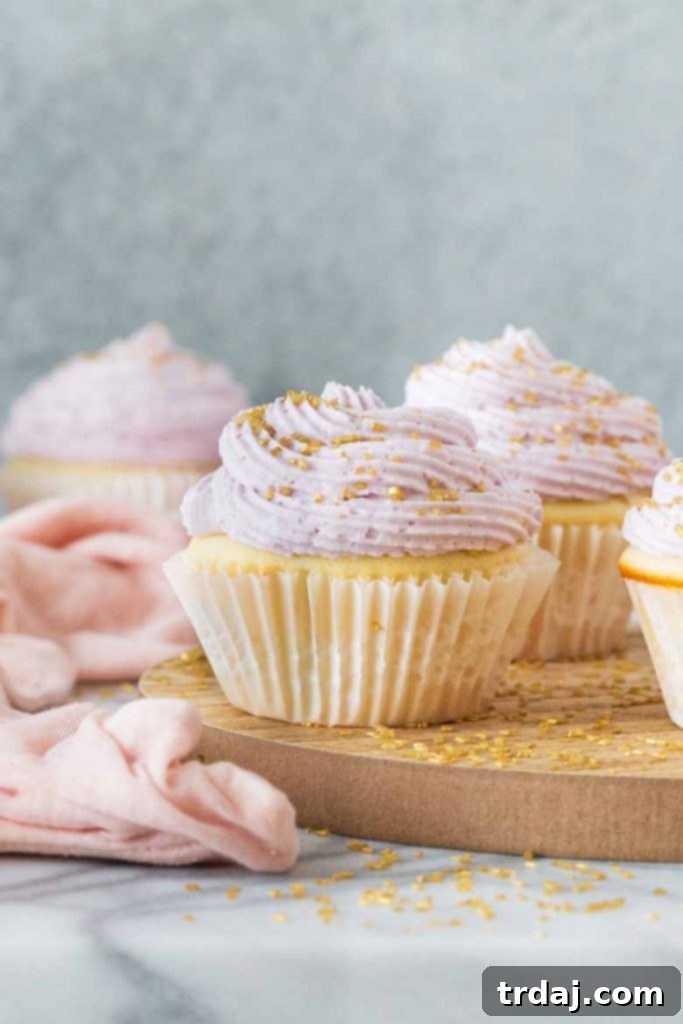Delicate Lavender Mimosa Cupcakes with a bubbly champagne base