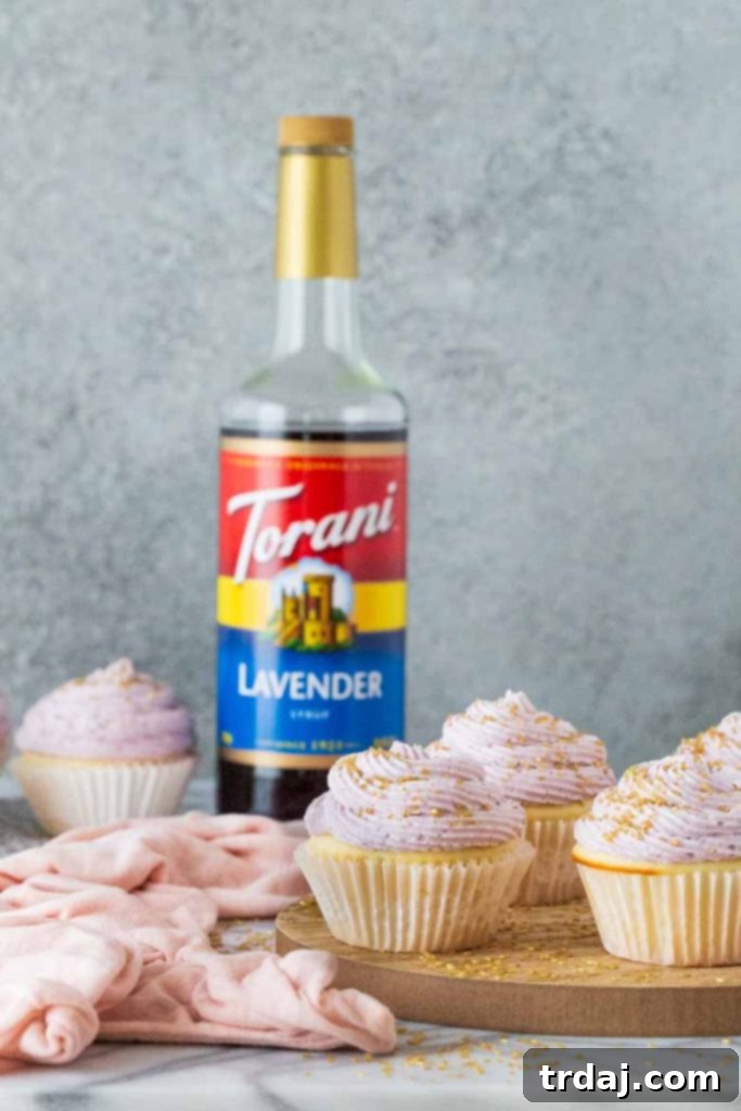 Close-up of fluffy Lavender Mimosa Cupcakes with champagne