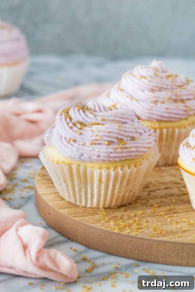 Beautifully piped Lavender Mimosa Cupcakes ready to serve