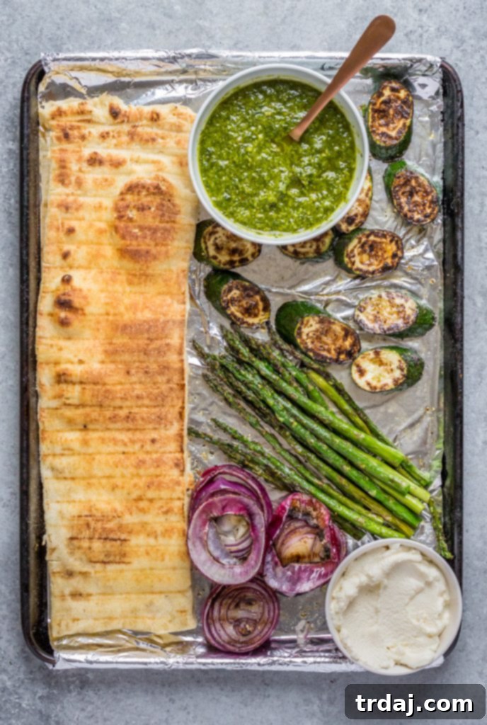 Grilling pizza dough on Kingsford charcoal for crispy homemade flatbreads.